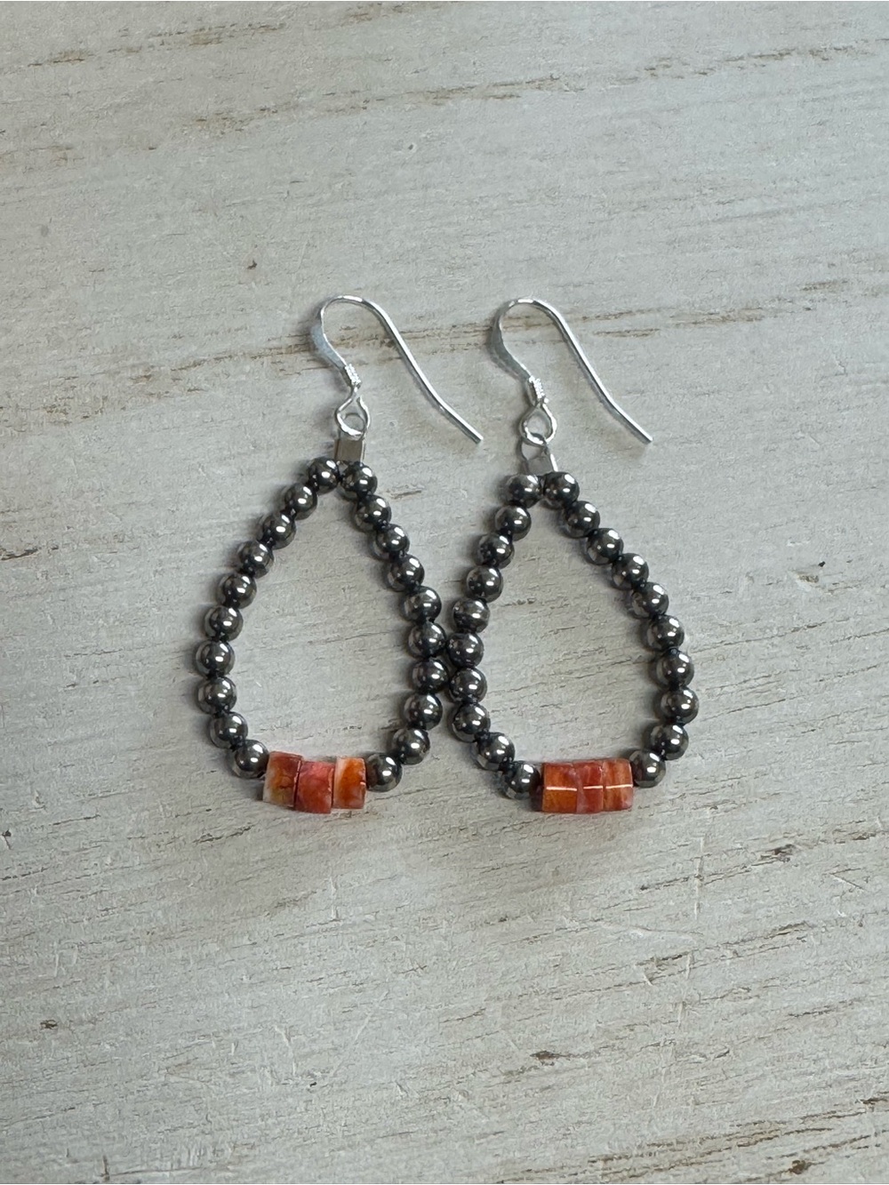 Southwestern sterling silver desert pearl and spiny oyster hoop earrings.